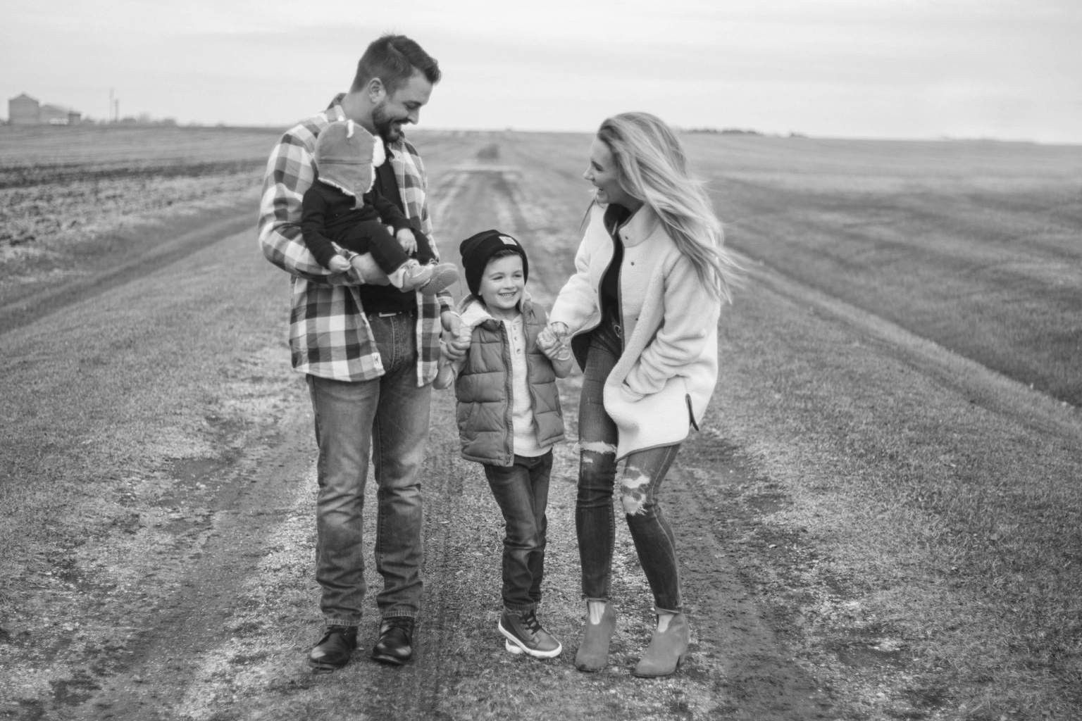 Laci with her husband and children on a country road