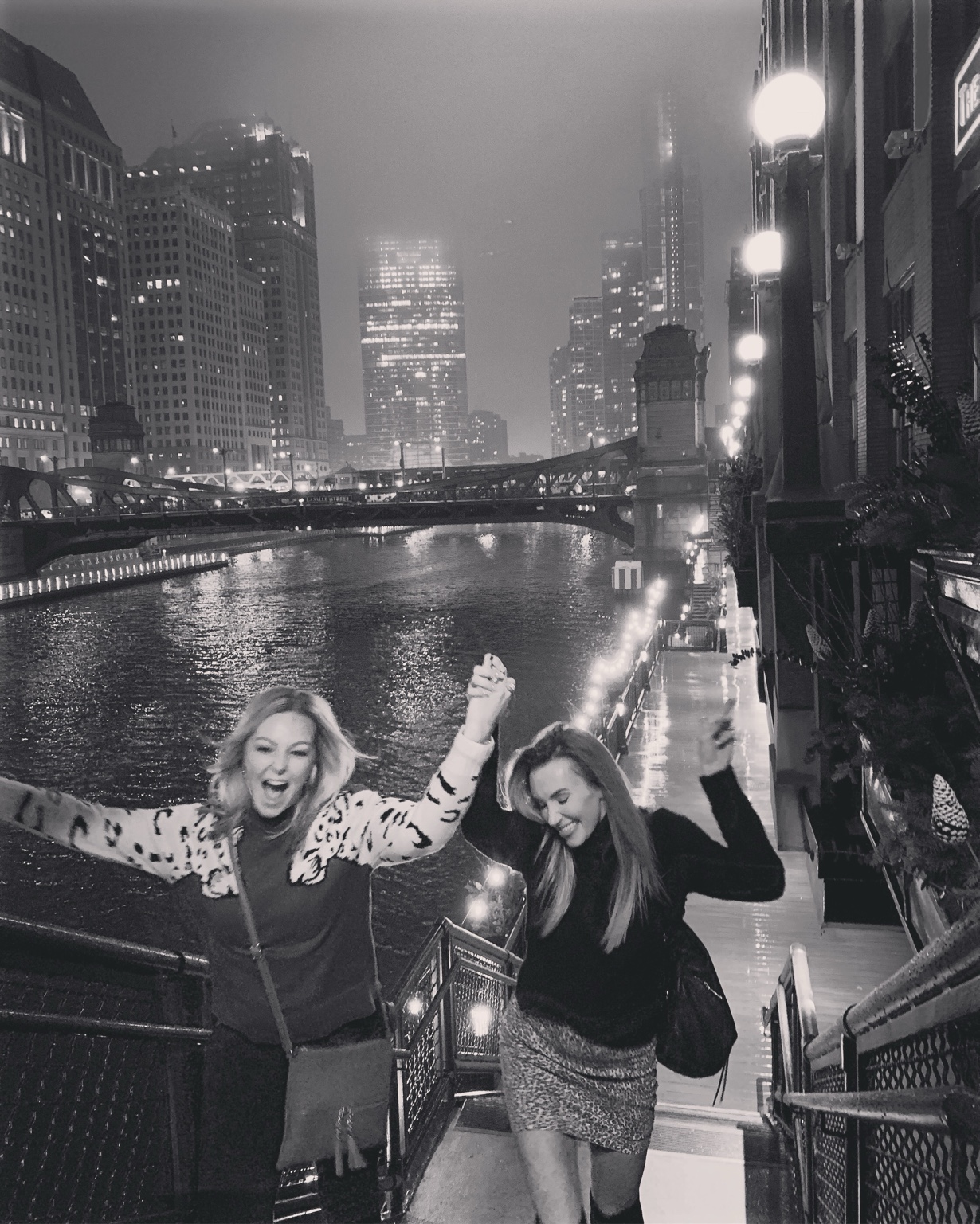 Laci and a close friend laughing along the Chicago Riverwalk